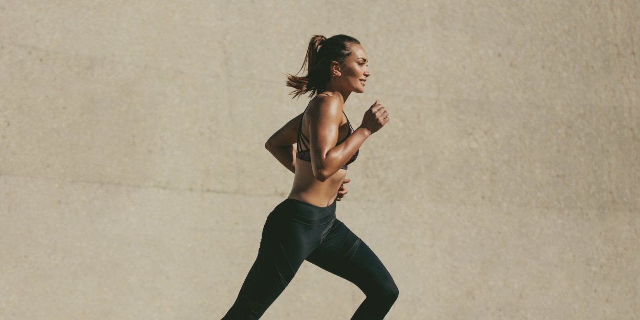 Woman running outdoors in activewear, representing wellness, hydration, joint health, fitness support, and personal care in Malta.