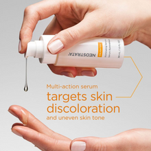 Load image into Gallery viewer, Hand holding a Neostrata Illuminating serum dropper with text about skin discoloration and uneven skin tone.