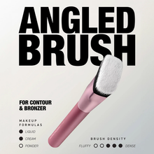 Load image into Gallery viewer, Marketing image of the Real Techniques angled makeup brush with a pink handle and slanted white bristles against a light background. Large bold text reads ‘ANGLED BRUSH,’ with additional text noting it is for contour and bronzer. Graphics indicate compatibility with liquid, cream, and powder formulas, along with a medium-dense brush density scale.