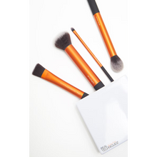 Load image into Gallery viewer, Set of makeup brushes with orange handles and black bristles on a white background