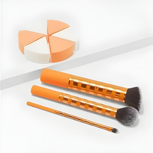 Load image into Gallery viewer, Set of orange makeup brushes and a sponge applicator on a white background