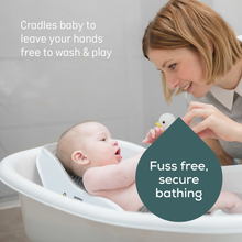 Load image into Gallery viewer, Baby cradled in the Angelcare Soft Touch Mini Baby Bath Support during bath time