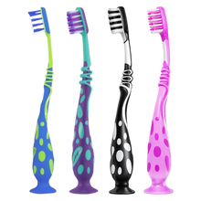 Load image into Gallery viewer, A lineup of four Aquafresh Big Teeth kids toothbrushes for ages 6 to 8