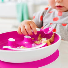 Load image into Gallery viewer, Baby eating from Munchkin Smiley Face Training Plate pink