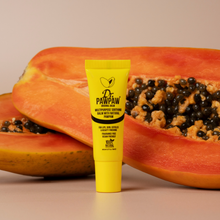 Load image into Gallery viewer, Dr. PAWPAW Original Clear Lip Balm 10ml in a yellow tube displayed in front of fresh papaya halves, highlighting its natural pawpaw ingredient.