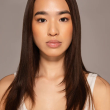 Load image into Gallery viewer, Dr.PAWPAW Shimmer Balm worn by a light skin model highlighting radiant lips and cheeks.