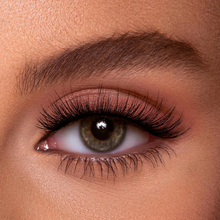 Load image into Gallery viewer, Close-up of natural eye wearing Eyecha Maple lashes with a soft, curled cat-eye effect.