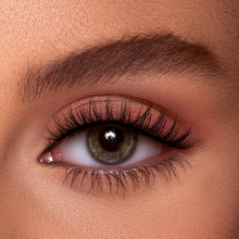 Load image into Gallery viewer, Close-up of Eyecha Sunset Lashes on eye showing curled, soft, and fluffy lash effect for a natural glam look