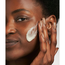 Load image into Gallery viewer, A close-up of a person applying NeoStrata Glycolic Microdermabrasion Polish to their face for skin resurfacing.