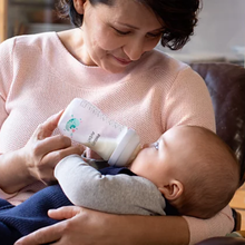 Load image into Gallery viewer, Parent feeding baby with a Philips Avent Natural Response 260ml baby bottle