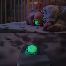Load image into Gallery viewer, A split-screen view of a toddler sleeping with a glowing Philips Avent Ultra Air Nighttime soother (SCF376/32) and a close-up of the glow-in-the-dark feature.