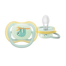 Load image into Gallery viewer, A close-up of a light green Philips Avent Ultra Air Night Time soother for babies 0–6 months, featuring a sleeping sloth character and a glow-in-the-dark button.