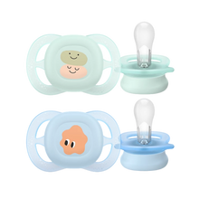 Load image into Gallery viewer, A two-pack of Philips Avent Ultra Air pacifiers in light green and blue, featuring cute character illustrations and breathable shields against a black background.