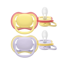 Load image into Gallery viewer, A two-pack of Philips Avent Ultra Air pacifiers featuring one yellow and red design and one purple and yellow design against a black background.