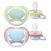 Load image into Gallery viewer, A 2-pack of Philips Avent Ultra Air soothers for boys 0–6m in mint green and light blue, featuring extra-large airholes for skin ventilation and symmetrical silicone teats.
