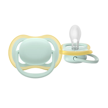 Load image into Gallery viewer, A close-up of a mint green Philips Avent Ultra Air soother for infants 0-6 months, featuring large airholes for skin ventilation and a clear silicone nipple.