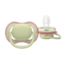 Load image into Gallery viewer, A close-up of a pastel green Philips Avent Ultra Air soother for toddlers 18 months and older, featuring large airholes for skin ventilation and a clear silicone nipple.