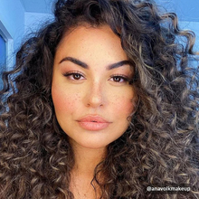 Load image into Gallery viewer, Pinky Goat ARWA lashes worn by model with voluminous curls, showing natural glam finish.