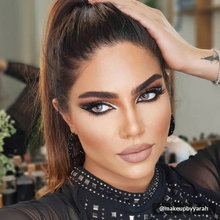 Load image into Gallery viewer, Makeupbyyarah flaunts MIA lashes with dramatic eyeliner and ponytail look.