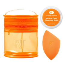 Load image into Gallery viewer, Orange skincare product set with container, soap bar, and applicator on a white background