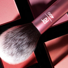 Load image into Gallery viewer, Close-up texture shot of the Real Techniques RT 400 Blush Brush bristles and pink handle, used for expertly blending blush or bronzer across powder makeup pans.