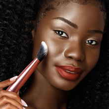 Load image into Gallery viewer, Woman applying makeup with Real Techniques Seamless Complexion Brush