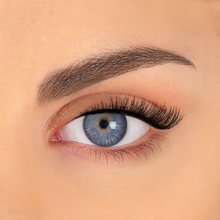 Load image into Gallery viewer, Close-up of RIMAS wispy lashes on blue-eyed model, perfect for small eyes and daily wear.