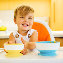 Load image into Gallery viewer, Toddler enjoying mealtime with Munchkin Stay Put™ suction bowls, designed to stay in place and reduce mess.