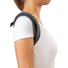 Load image into Gallery viewer, Woman wearing the Uriel Posture Corrector from the side, showing the padded shoulder straps designed for upper back support and posture alignment.