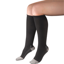 Load image into Gallery viewer, Uriel Silver Flight Compression Socks in dark grey with light grey reinforced heels and toes, featuring a knee-high design for travel comfort.