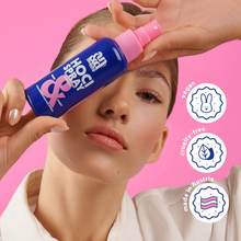 Load image into Gallery viewer, A woman holding a bottle of HOCl Spray against a pink background with icons for vegan, cruelty-free, and made in Austria.