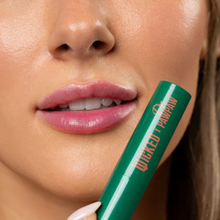 Load image into Gallery viewer, Close-up of a woman's lips with a green lip liner labeled 'Wicked Pan' held close to her mouth.