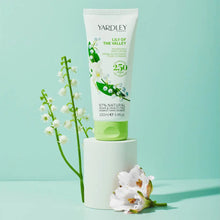Load image into Gallery viewer, Yardley London Lily of the Valley Nourishing Hand Cream (100ml) lifestyle image, a vegan and cruelty-free hand moisturizer with 97% natural ingredients and a classic white floral scent.
