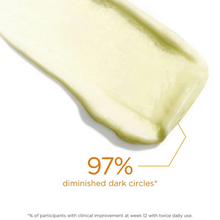 Load image into Gallery viewer, Close-up of a skincare product with a droplet effect on a white background, featuring text about diminished dark circles.

