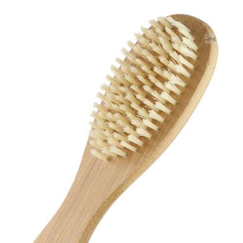 A bamboo foot brush with soft bristles and a curved handle designed for exfoliating the skin.