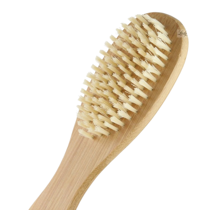 A bamboo foot brush with soft bristles and a curved handle designed for exfoliating the skin.