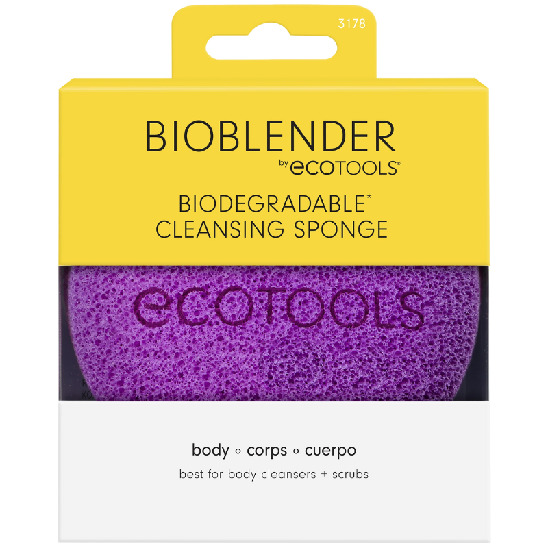 A purple Eco Tools body cleansing sponge with a loop for hanging.