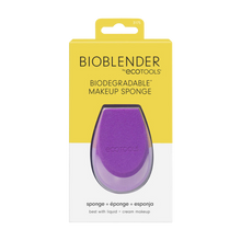 Load image into Gallery viewer, A purple biodegradable makeup sponge from Eco Tools, placed in front of its yellow packaging box with &#39;BIOBLENDER&#39; and &#39;100% biodegradable makeup sponge&#39; printed on it.
