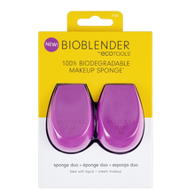 Load image into Gallery viewer, Packaging of ECO TOOLS BIOBLENDER DUO makeup sponges, with one sponge displayed in purple color and the other in a dotted pattern, indicating the product is made with 100% biodegradable material.
