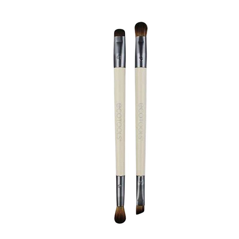 Two beige eyelash brushes with black bristles, one with a flat base and the other with a rounded base, both labeled with 'Eco Tools'.