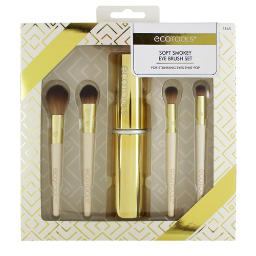 A set of ECO TOOLS soft smokey eye brushes with beige handles and gold ferrules, presented in a packaging with a geometric pattern.