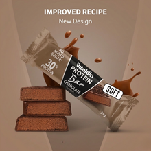 Load image into Gallery viewer, Promotional image for the Vitaldin Chocolate Protein Bar featuring an "Improved Recipe" and "New Design." The visual includes the 35g bar wrapper, a stack of soft chocolate bar pieces, and liquid chocolate splashes on a brown background.
