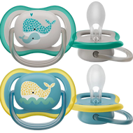 Two Philips Avent ultra air pacifiers with whale designs in blue and yellow colors, extra-large airholes, and extra-firm nipples.