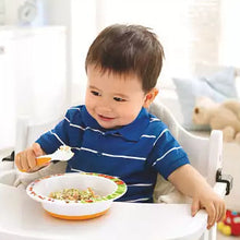 Load image into Gallery viewer, A toddler sitting in a high chair using a Philips Avent spoon and fork to eat from a plate.
