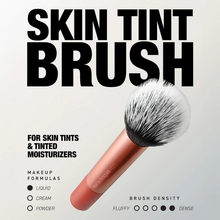 Load image into Gallery viewer, Marketing image of the Real Techniques Skin Tint Brush with bold text reading ‘SKIN TINT BRUSH.’ The image highlights use with skin tints and tinted moisturizers, liquid makeup compatibility and medium-dense brush fibers.
