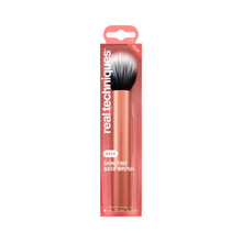 Load image into Gallery viewer, Packaging for the Real Techniques RT271 Skin Tint Base Brush featuring a rose gold handle and fluffy black-and-white bristles. Text highlights it as a base brush for liquid, cream and powder formulas.
