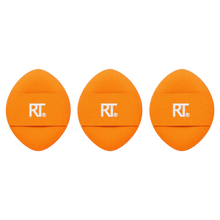Load image into Gallery viewer, Three Real Techniques orange oval-shaped powder puffs with RT logo bands, designed for setting powder application and liquid makeup touch-ups.
