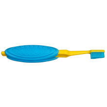 Load image into Gallery viewer, The TePe Extra Grip on a toothbrush, giving a visual representation of how it can be used.
