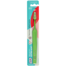 Load image into Gallery viewer, Green toothbrush with pink bristles in TePe packaging on a white background
