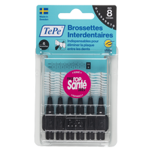 Load image into Gallery viewer, TePe Interdental Brush set in clear plastic packaging, featuring six black-handled interdental brushes with metal tips and a blue-and-white header card.
